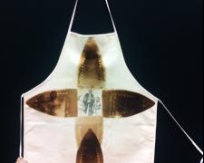 St. Mammy Mother Redemption, 2012, iron relief prints, transfer prints on canvas apron, found objects, 40 1/2 x 24"