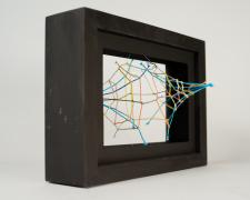 "Black [Peering Through]" (View 2), 2021, embroidery floss, clear cord, matted wood frame, 8 x 4.5 x 6"