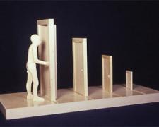 Man Opening Door, 2002, wood, 9 1/2 x 18 1/2 x 7 1/2"