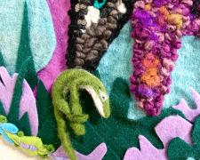 Angelica Raquel, "Everyday He Visited Me" (detail), 2023, hand hooked yarns, felt, embellishment, needle felted anole lizard, second hand embroidered border on monks cloth, 23 x 16"
