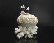 "Beached Buddha", 2024, egg, mixed media, 6 x 4 1/2 x 4"