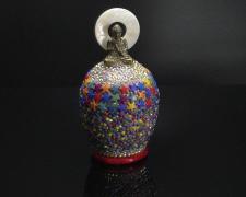 "Buddha of the Cosmos", 2024, egg, mixed media, 4 1/2 x 2 1/4 x 2 1/4"