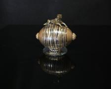 "Disguised", 2024, egg, mixed media, 3 1/4 x 3 1/2 x 2"