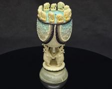 "Oasis", 2026, egg, mixed media, 5 x 2 1/2 x 2 1/2"