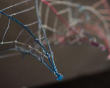 Ronald L. Jones, "Black [Genetics]" (detail), 2021, embroidery floss, clear cord, LED lights, wood enclosure, 10 x 5 x 7 1/2"