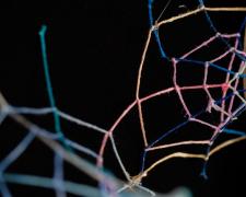 "Black [Underneath The Surface]" (Detail), 2021, embroidery floss, clear cord, matted wood frame, 8 x 3.5 x 6"