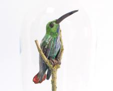 "Hummingbird", 2023, foil, wire, papier-mâché, wood, 11 x 6 x 6"