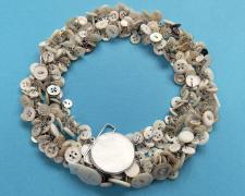 "Buttoned Up (view 1)", 2025, necklace: antique mother-of-pearl buttons, sterling, stainless steel, 9 x 9 x 1 1/2"