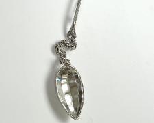 "Demitasse", 2026, brooch: sterling, stainless steel, 5 5/8 x 3/4 x 1/2"