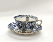 "Elixir II" (view 2), 2026, bangle cup and saucer: porcelain, sterling, tin, stainless steel, cup: 2 1/2 x 5 x 4"; saucer: 5 3/4 x 5 3/4 x 1"