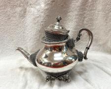 "Heirloom Impotence, Teapot", 2025, silverplate teapot, stainless steel, 9 x 11 x 6 1/2"