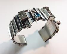Edward Lane McCartney, "Loloma II", 2017, cuff bracelet: sterling, bronze, brass, Russian rainbow pyrite, London blue topaz, 1 1/2 x 2 1/2 x 2 1/4"