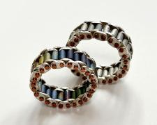 "Mechanic II" (pictured left), 2024, ring: sterling, copper, anodized niobium