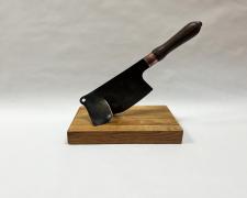 "Meeting Resistance", 2025, appropriated and manipulated vintage meat cleaver, 12 x 15 x 7 1/2"