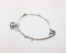 Perimeter #3, 2018, bangle bracelet: sterling, fine silver, hematite, 3 1/4 x 2 1/2 x 1/4"