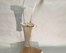 "Punch I", 2025, appropriated and manipulated vintage silver plate ladle, nickel, walnut, brass, 23 x 6 x 12"