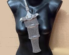 "Punch II", 2025, neckpiece: appropriated and manipulated vintage silver plate punch ladle, stainless, 16 x 6 x 11 1/2"