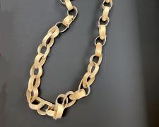 "Say Ahh..." (view 1), 2026, necklace: wooden tongue depressors and zip-ties, 68 x 3 x 2"