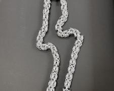 "Scale, Byzantine (view 2)", 2026, necklace: aluminum, 66 x 6 x 1 1/4"