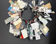 "Tagged", 2025, necklace: clothing tags, sterling, 20 x 20 x 2"