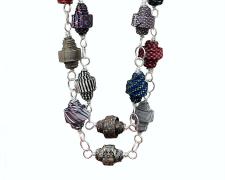 "Work", 2025, necklace: aluminum, men's silk neckties, 32 x 10 x 5"
