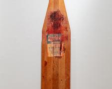 "Firm", 2023, transfer print on vintage ironing board, 54 x 13 x 1 1/2"
