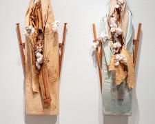 "For His Protection", 2023, mixed media: intaglio, vintage wood ironing board, plantation cotton, 42 x 13 x 1 1/2" (Pictured on the Left)
