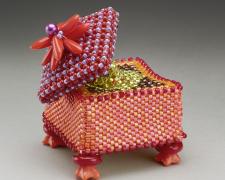 Heather Logan, "Orange Expands", beadwork, 1 1/2 x 1 1/2"