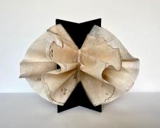 Anna Mavromatis, "Scorching August Affair (as seen by a woman)", 2019, paper sculpture: tea-toned industrial coffee filters with charred markings draped and held by a concertina folded center, 10 x 14 x 14"
