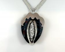 Jessica Jacobi, "Guarded Crevice", 2023, freshwater pearls, poplar, Prismacolor pencil, sterling silver, 12" long / pendant: 3 1/4 x 2 1/4 x 1/4"