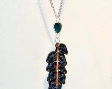 Jessica Jacobi, "Urticating Curtain", 2023, labradorite, poplar, Prismacolor pencil, sterling silver, 20 3/4" long / pendant: 8 x 2 1/4 x 1/4"