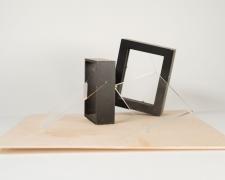 "Lightening [TFRS] An Understanding [Or No. 6]" (View 2), 2021, acrylic sheets, embroidery floss, clear cord, cardboard frame, wood frame, wood base, 12 x 12 x 6"