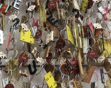 "Measured" (detail), 2021, wall mobile: brass, aluminum, bronze, found objects, 16 x 44 x 4"