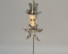 Edward Lane McCartney, "Memento Mori I, Boulevardier", 2023, stickpin pendant: fabricated sterling, carved bison bone, 14k yellow gold, and diamonds
