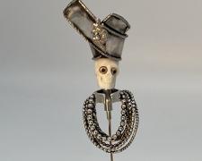 Edward Lane McCartney, "Memento Mori IV, Maharajah", 2023, stickpin: fabricated sterling, carved bison bone, 14k and 10k yellow gold, platinum, diamond, rubies
