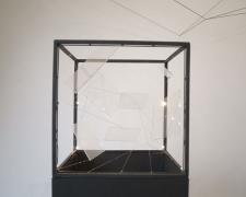 "Monolith [A Message From The Future]" (Detail), 2021, aluminum frame, lucite sheets, clear cord, gold embroidery floss, LED lights, composite wood base, 18 x 21 x 57"
