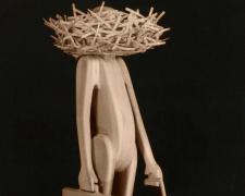 Man with Head in Nest (Large), 1990, pine wood, 50 x 21 x 24 3/4"