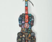 "Out of Gas", 2018, violin (torched), vintage toy cars (1954 Tvr, 1953 Cadillac, 1930s Morgan), toy cars (torched), and mixed media, 36 1/2 x 8 x 5"