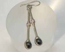 Edward Lane McCartney, "Pendulous", 2023, earrings: fabricated sterling and hematite