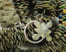 Puzzled #10, 2016, necklace puzzle pieces and sterling, 60 x 1 x 1"
