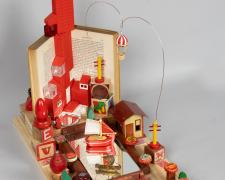 "The Red City", 2024, assemblage, 17 x 19 x 10 1/2" (view 1)