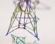 "Specimen No. 2" (Detail 1), 2021, embroidery floss, clear cord, corked glass jar, 3 x 3 x 4.5"