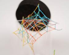 "Specimen No. 3" (Detail 1), 2021, embroidery floss, clear cord, corked glass jar, 5.5 x 4.5 x 6.5"