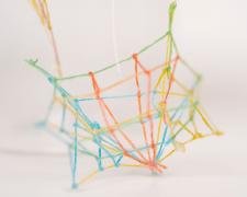 "Specimen No. 3" (Detail 2), 2021, embroidery floss, clear cord, corked glass jar, 5.5 x 4.5 x 6.5"