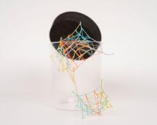 "Specimen No. 3" (View 2), 2021, embroidery floss, clear cord, corked glass jar, 5.5 x 4.5 x 6.5"