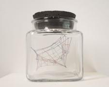 "Specimen No. 4", 2021, embroidery floss, clear cord, corked glass jar, 3.5 x 3.5 x 4.5"