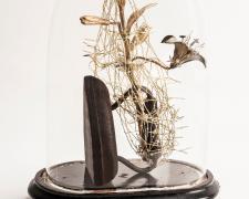 Karin Broker, '"it's complicated" she said', 2018, wired brass flowers with crystals, antique iron, glass dome, object: 13 x 7 1/4 x 5", dome: 15 x 10 1/2 x 6 1/4" (Courtesy of McClain Gallery)