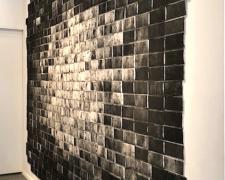 Untitled (Una cancion desesperada), 2018, asphalt, sand, cement mix, graphite, charcoal, dirt on lint roller sheets, processed by cement mixer, 115 x 179"