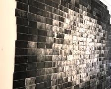 Untitled (Una cancion desesperada), 2018, asphalt, sand, cement mix, graphite, charcoal, dirt on lint roller sheets, processed by cement mixer, 115 x 179"
