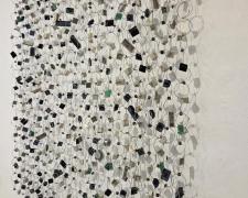 "Communication", 2025, wall hanging assemblage: computer keyboard keys, stainless steel, aluminum, 35 x 36 x 3"